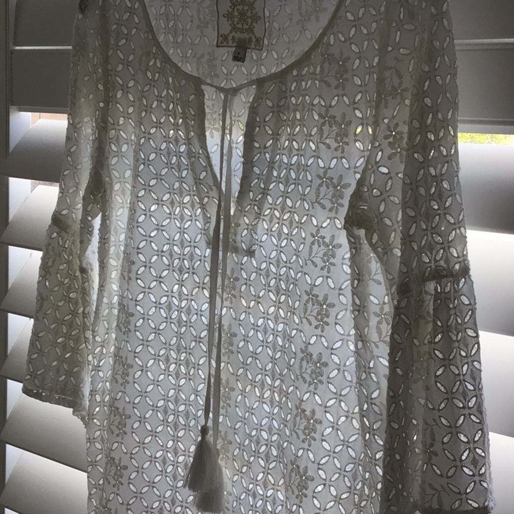 Johnny Was white eyelet top with bell sleeves.